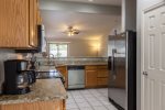 Open kitchen w/ granite counter tops and stainless steel appliances